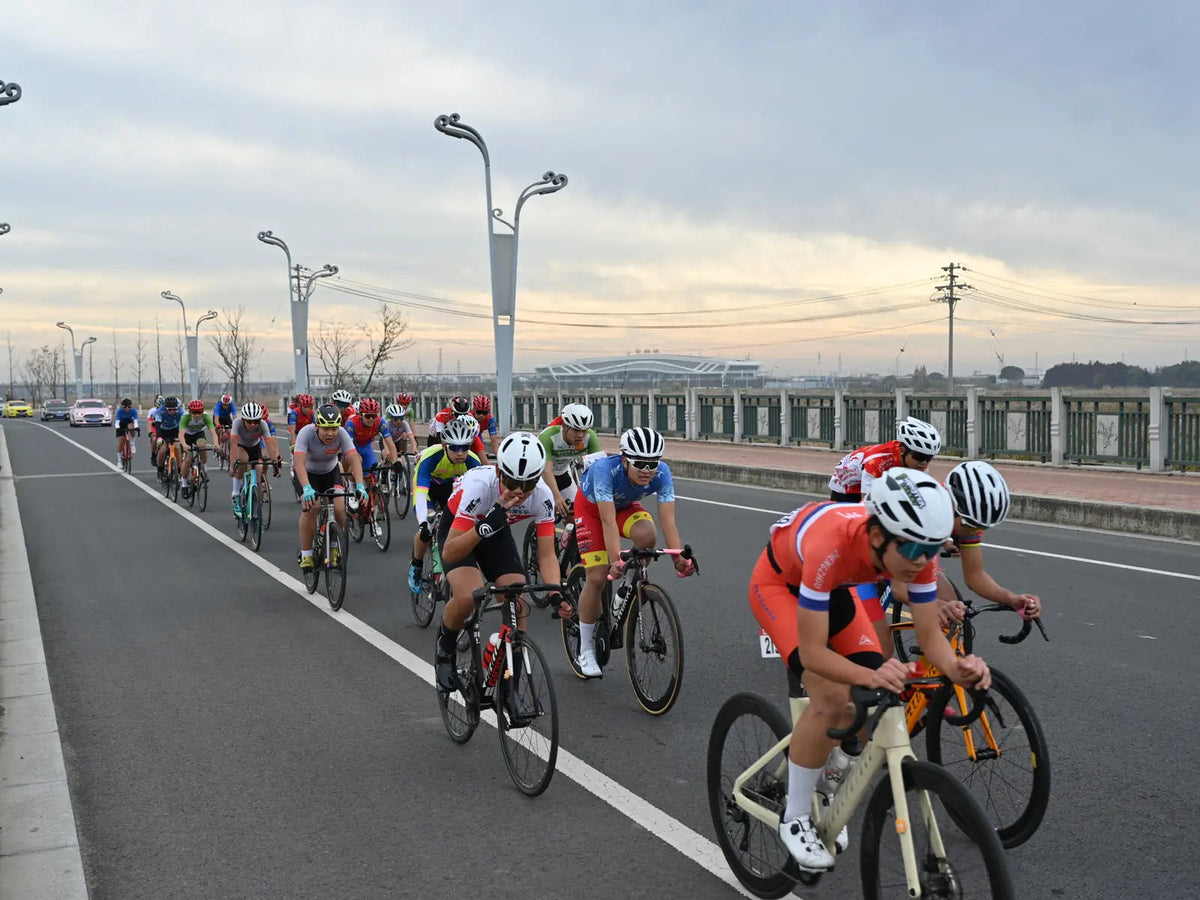 Cyclists riding together in club kits.