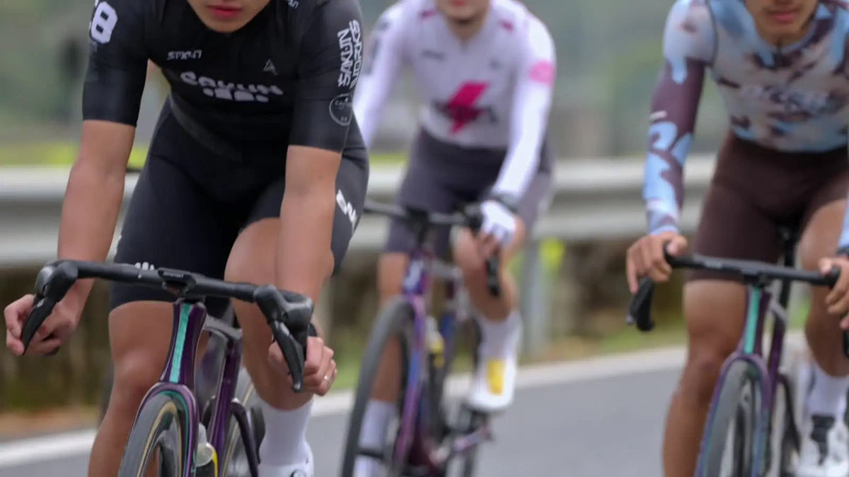 DEER cycling jerseys shown in a forward riding position.