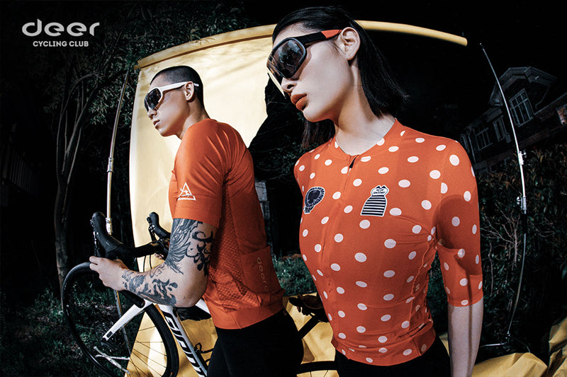DEER cycling apparel photographed on two riders, with original brand graphics.
