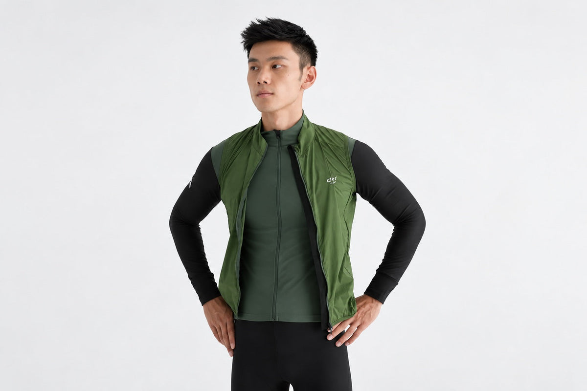 A DEER sleeveless cycling vest layered over a long-sleeved jersey.