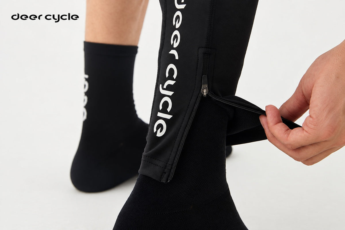 A rider opening the ankle zipper on a DEER leg warmer.