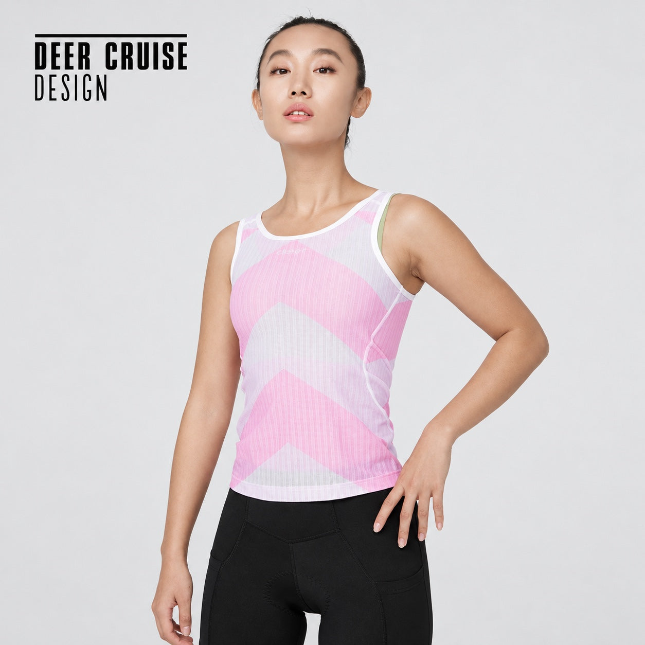Women’s pink-and-white mesh cycling base layer shown on a model